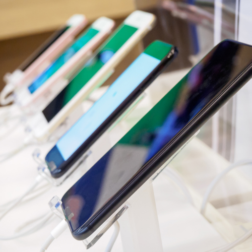 Happy customer browsing certified pre-owned phones